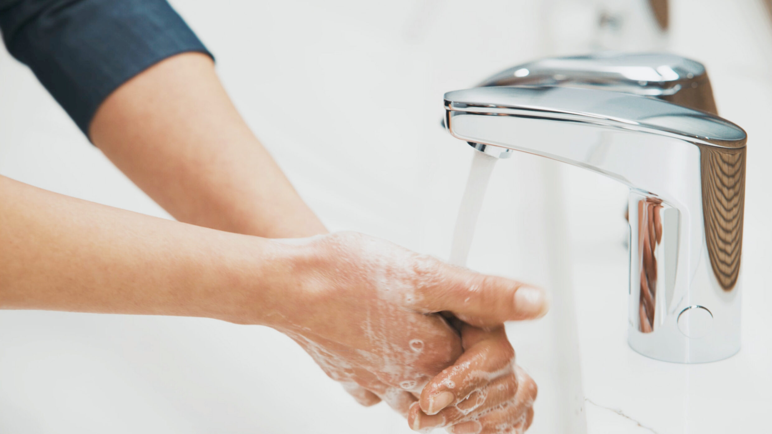 Close-up of handwashing to demonstrate Sloan's touch-free sensor technology