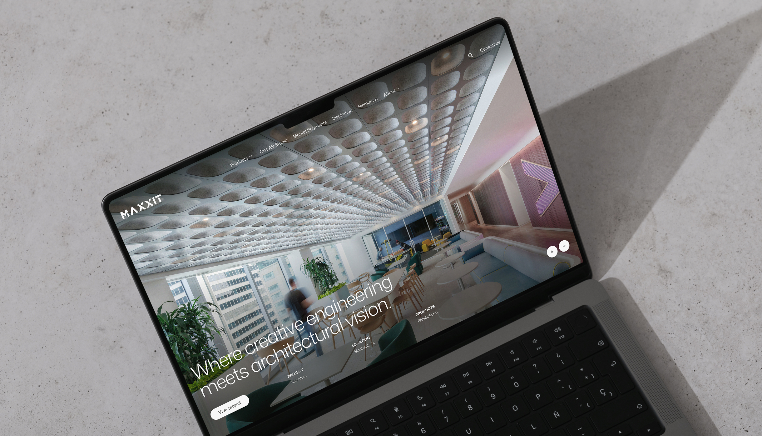 Maxxit Group laptop website mockup