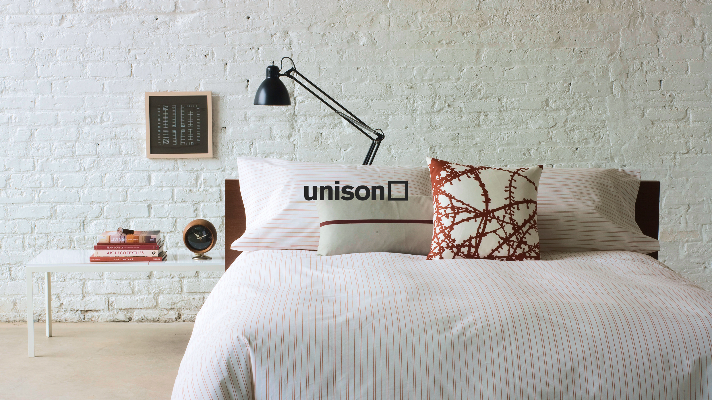 Unison logo over bedroom