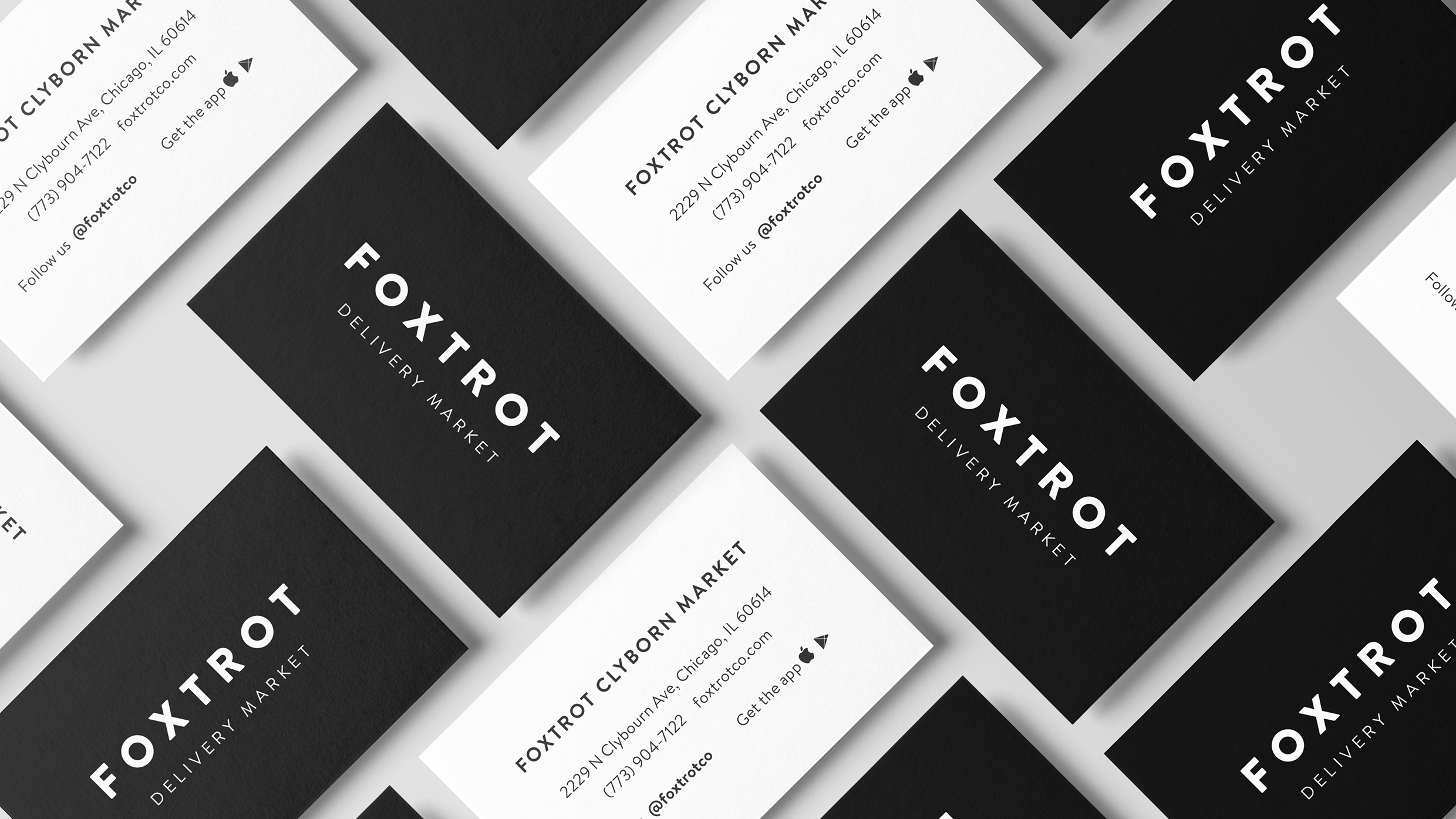 Grid layout of black and white business cards for Foxtrot Delivery Market.