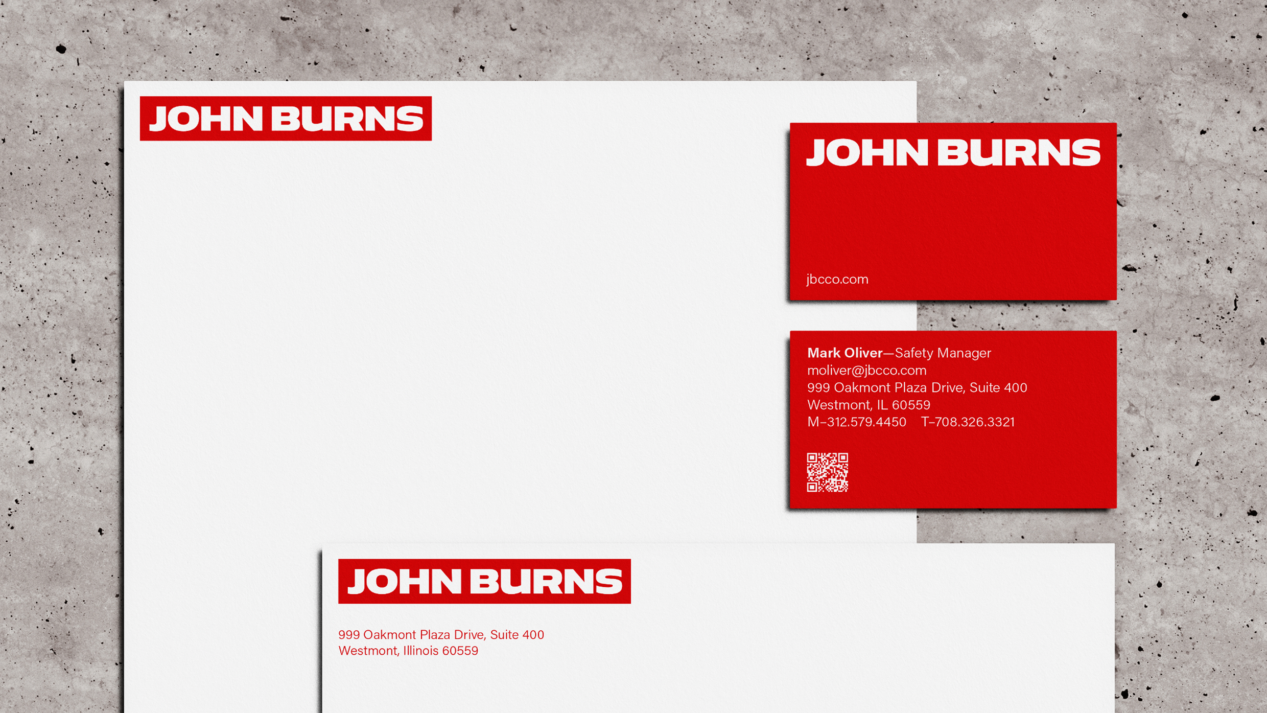 John Burns corporate stationery set including white letterhead, envelopes, and red business cards.