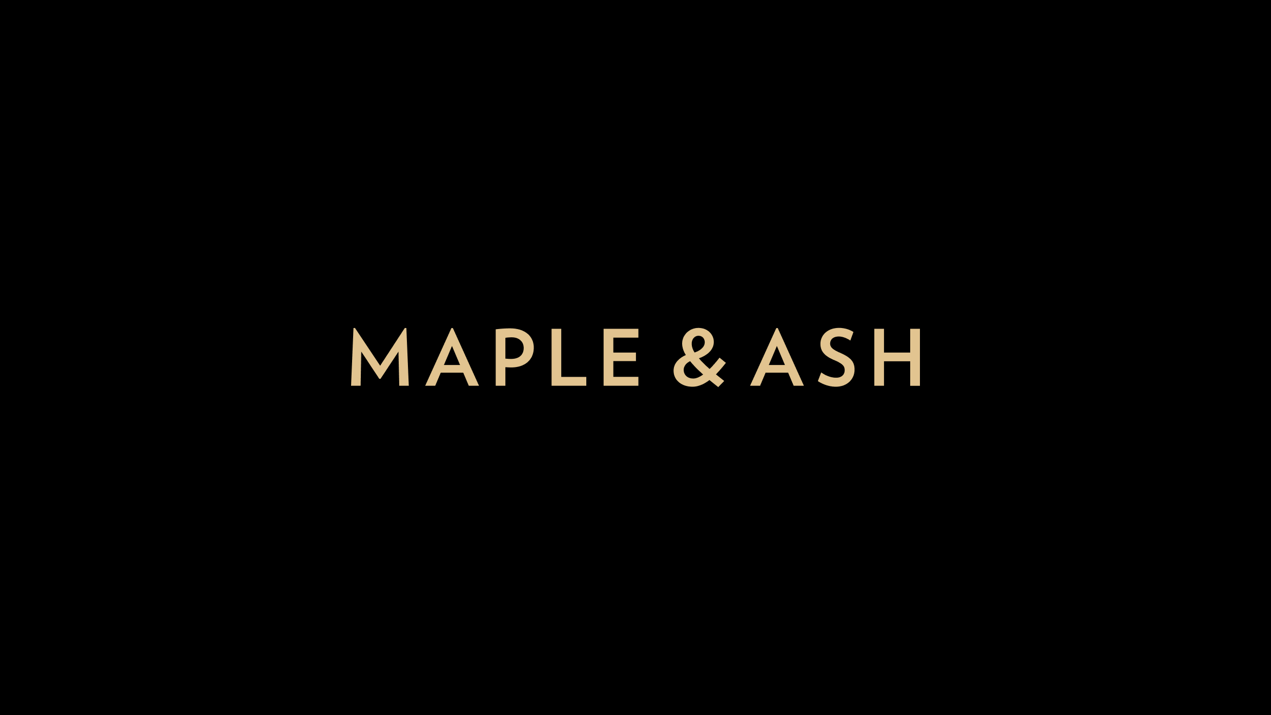 Maple & Ash gold wordmark logo on black background