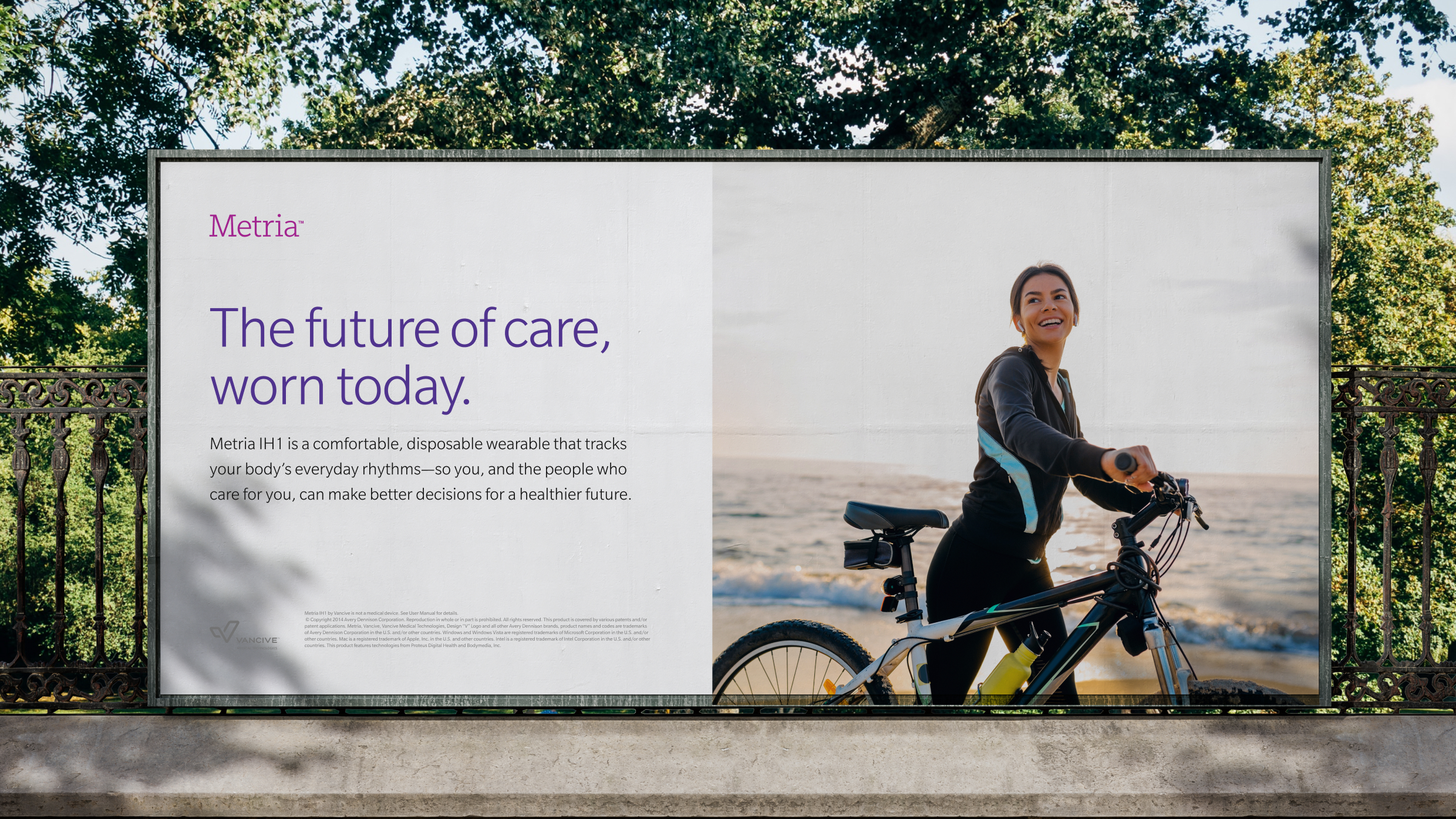 Outdoor billboard advertisement for Metria featuring a smiling woman standing with a bicycle.
