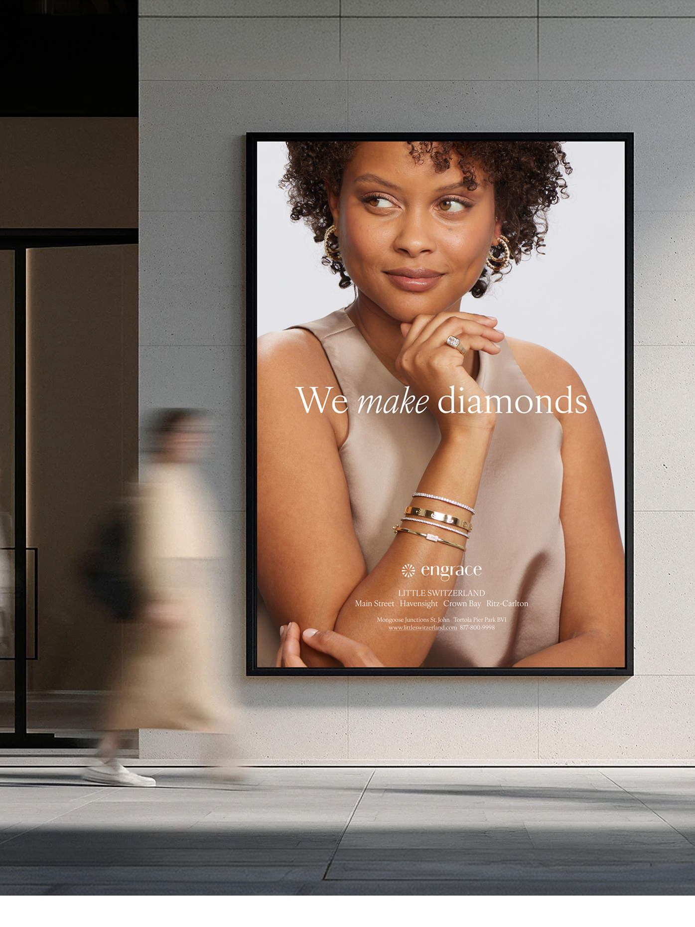 Engrace diamond jewelry advertisement poster displayed on a city wall.