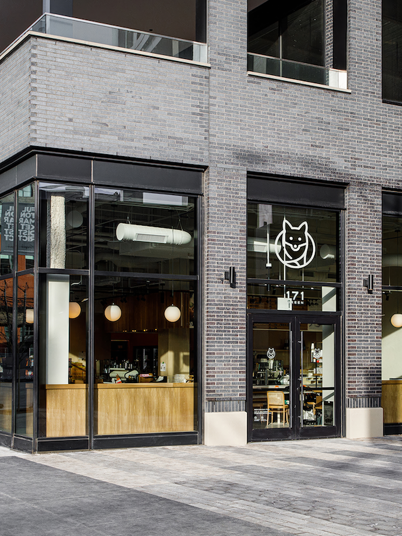 Exterior view of a Foxtrot storefront featuring large glass windows and logo.